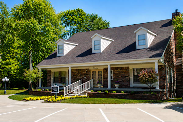 A house with a front porch and a driveway.